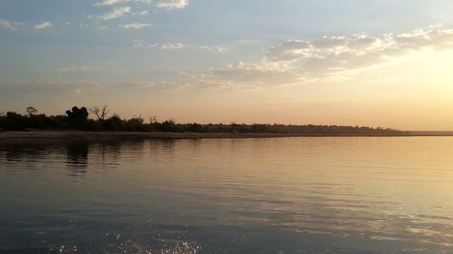 African sunset on Chobe river view from boat, Chobe National Park, Botswana
