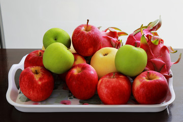 fruit in a tray on wood table