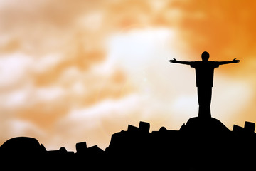 sillouette man with faith praying under god light