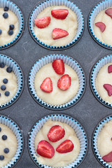 A tray of raw muffins. Ready for insertion into the oven.