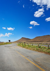 Long road through African karoo arid landscape