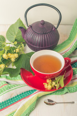Red cup of linden tea