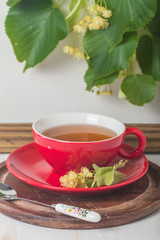 Red cup of linden tea