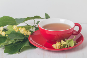 Red cup of linden tea