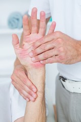 Fototapeta premium Physiotherapist doing hand massage 