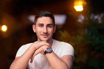 Young Man Sitting in a Restaurant