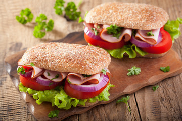 sandwich with ham tomato and lettuce