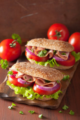 sandwich with ham tomato and lettuce