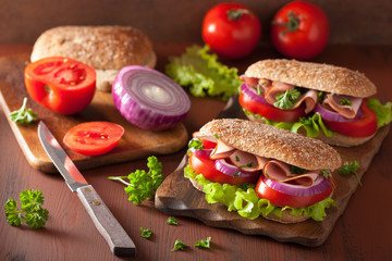 sandwich with ham tomato and lettuce