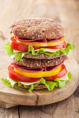 healthy sandwich with salami tomato pepper and lettuce