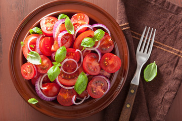 healthy tomato salad with onion basil olive oil and balsamic vin