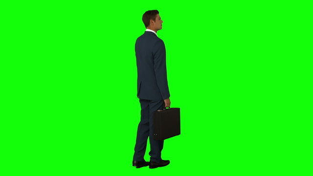 Businessman standing with his briefcase