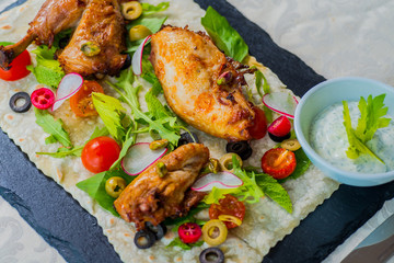 Fried chicken served with vegetables