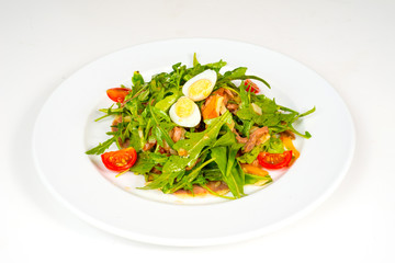 Pashot egg and salad with backed duck, rucola, cherry tomatoes