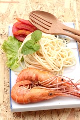 Pasta spaghetti with shrimp on the plate.