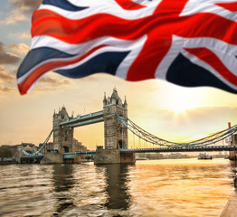 Fototapeta na wymiar London Tower Bridge with flag of England