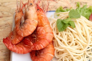 Pasta spaghetti with shrimp on the plate.