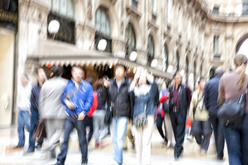 Shopping crowd walking on sidewalk