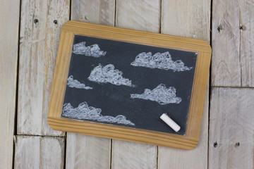 Small blackboard with white chalk