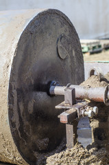 Wheel to press mud to made mud bricks