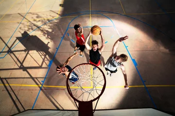 Gordijnen young basketball players playing with energy © Cristina Conti