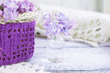 Lilac flowers in a small glass bottle