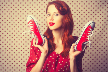 Portrait of redhead girl with gumshoes