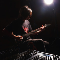 Obraz na płótnie Canvas guitarist recording and playing guitar