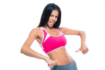 Fototapeta premium Fitness woman showing finger at her belly