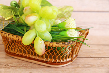 Fototapeta na wymiar Portion of fresh Green Grapes on vintage wooden background