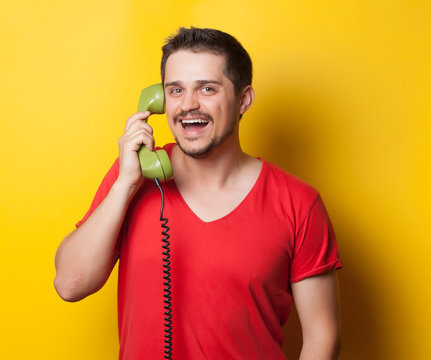 guy with green retro dial phone