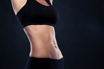Fototapeta na wymiar Closeup of a fit woman's abs