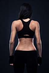 Fototapeta na wymiar Back view portrait of a fitness woman