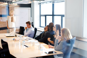 Female white executive leading a meeting