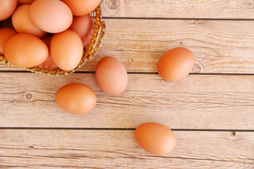 Eggs in the basket on wooden background