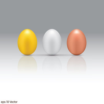 Gold, Silver, Bronze eggs on a white background.
