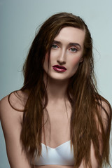 Naklejka premium Beauty Girl with perfect Skin, wet Hair and red Lips
