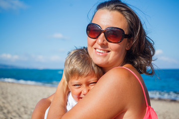 Fototapeta premium Mother and her son at beach