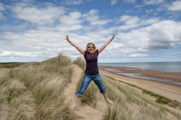 Fototapeta premium woman jumping for joy 