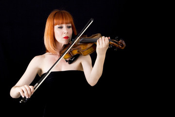  red hair violinist woman  isolated on black background