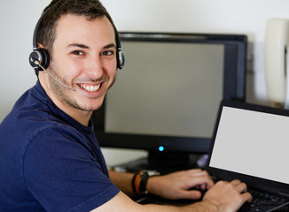 Young Call Center Agent Guy Smiling at the Camera