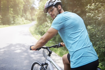 Adult man turning back on the road