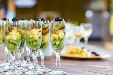 Fresh fruit cuts in champagne party glasses