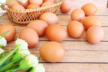 Eggs in the basket on wooden background