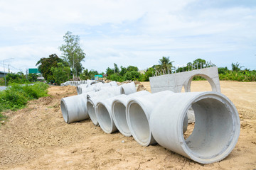 Concrete drainage pipes stacked for construction, irrigation, in