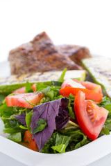Vegetable salad with grilled beef isolated on white background