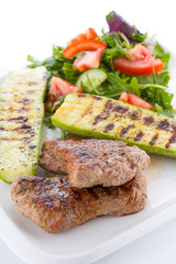 Vegetable salad with grilled beef isolated on white background