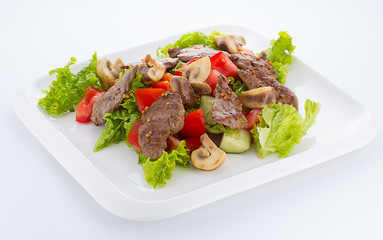 Vegetable salad with grilled beef isolated on white background