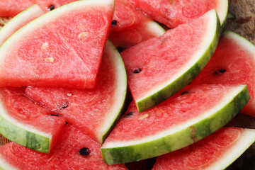 Slice of fresh watermelon on wooden background