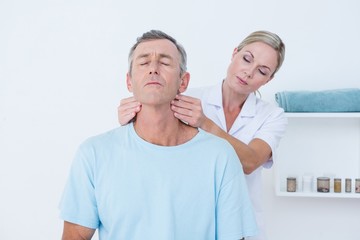 Doctor doing neck adjustment